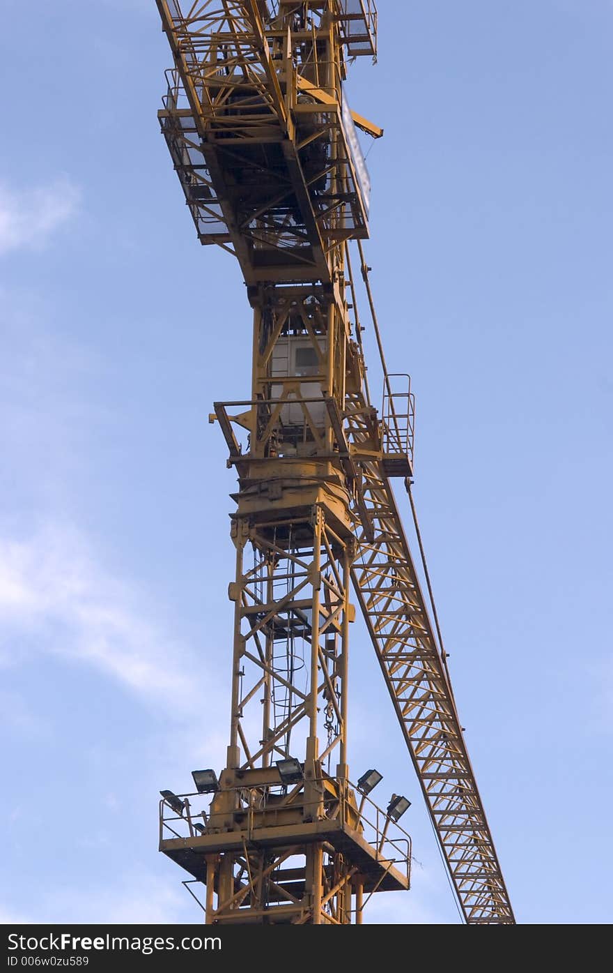 Construction crane with blue sky as a background