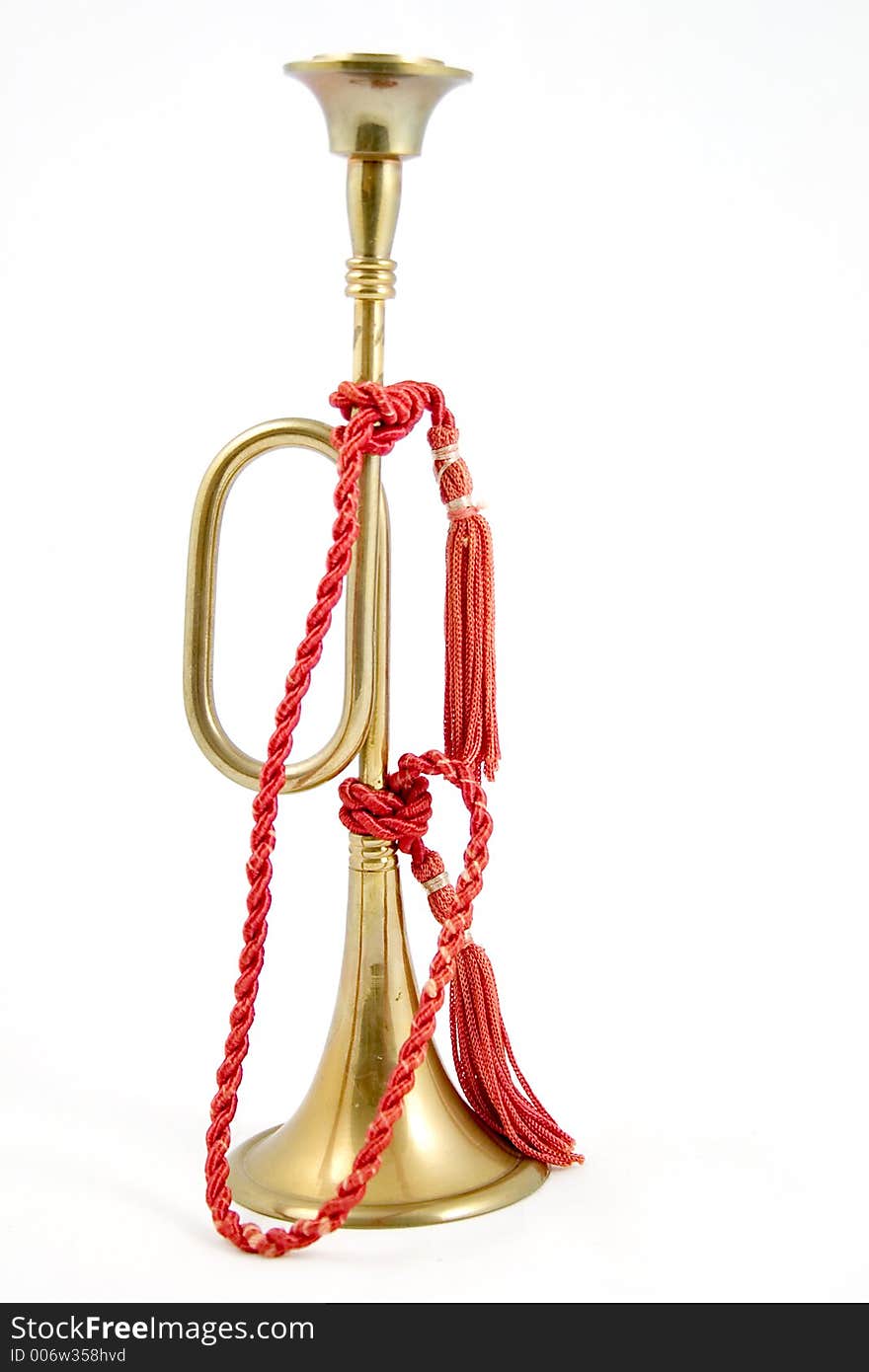 Brass bugle with red rope. Brass bugle with red rope.