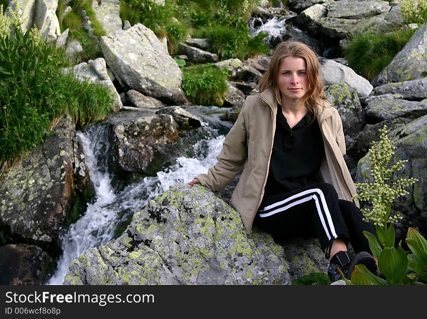 Women portrait near waterfall