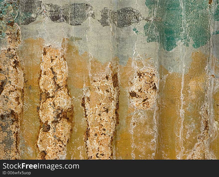 Detail of a piece of aluminum siding used as a wall in Mexico.  It had been repainted with signs many times. Detail of a piece of aluminum siding used as a wall in Mexico.  It had been repainted with signs many times.