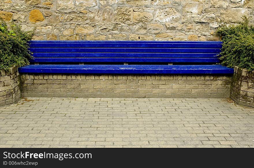 Blue city bench with block paving. Blue city bench with block paving