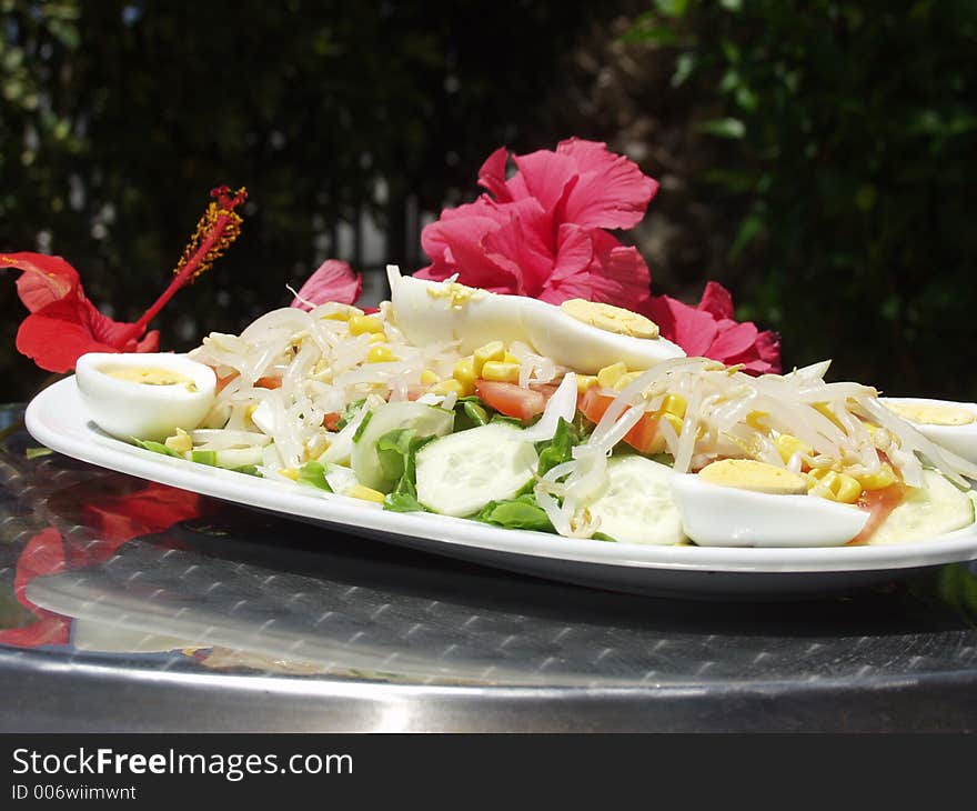 Fresh salad whit flowers background. Fresh salad whit flowers background