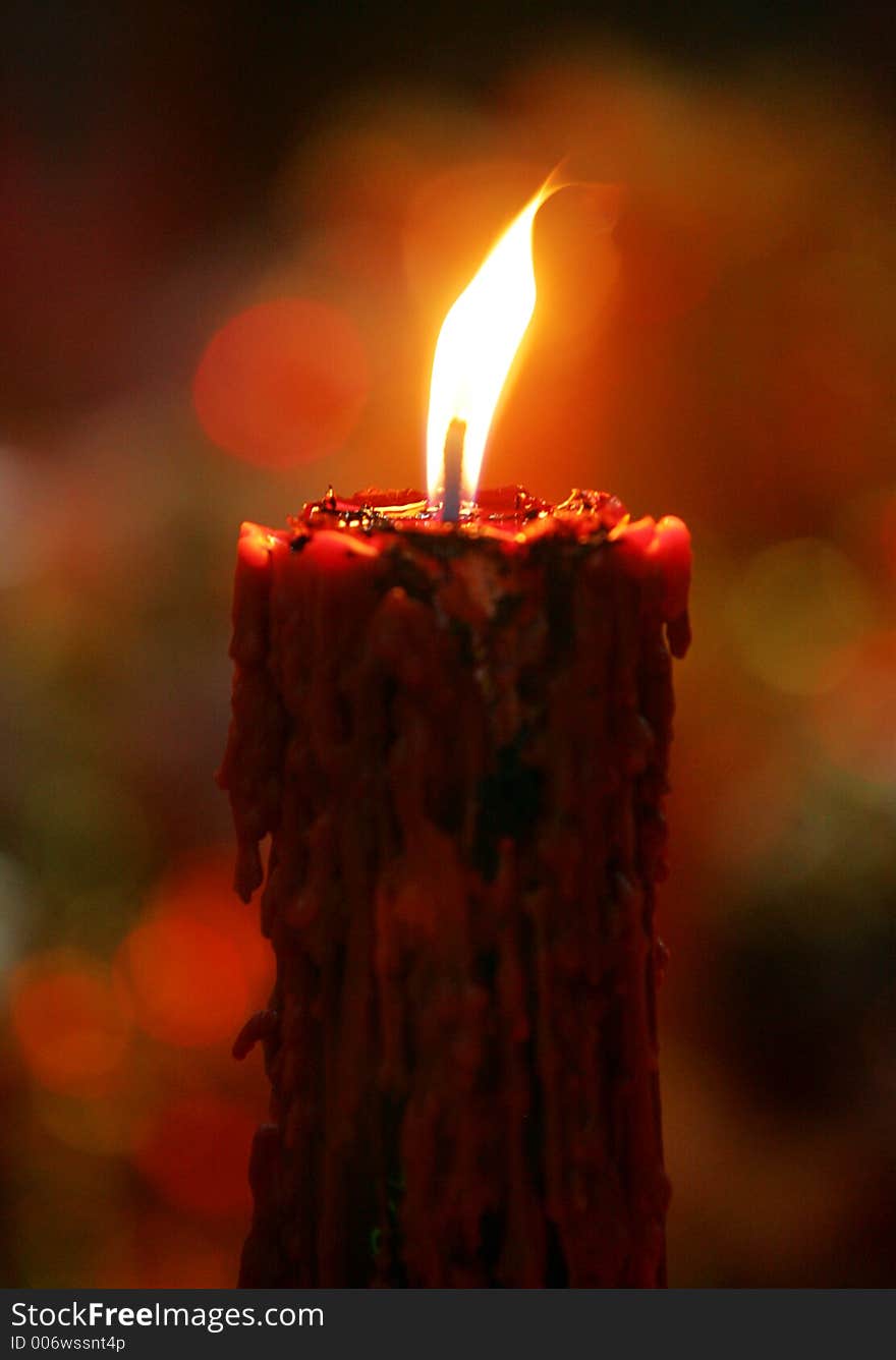 A candle is lighted during a Chinese festival, 2005.