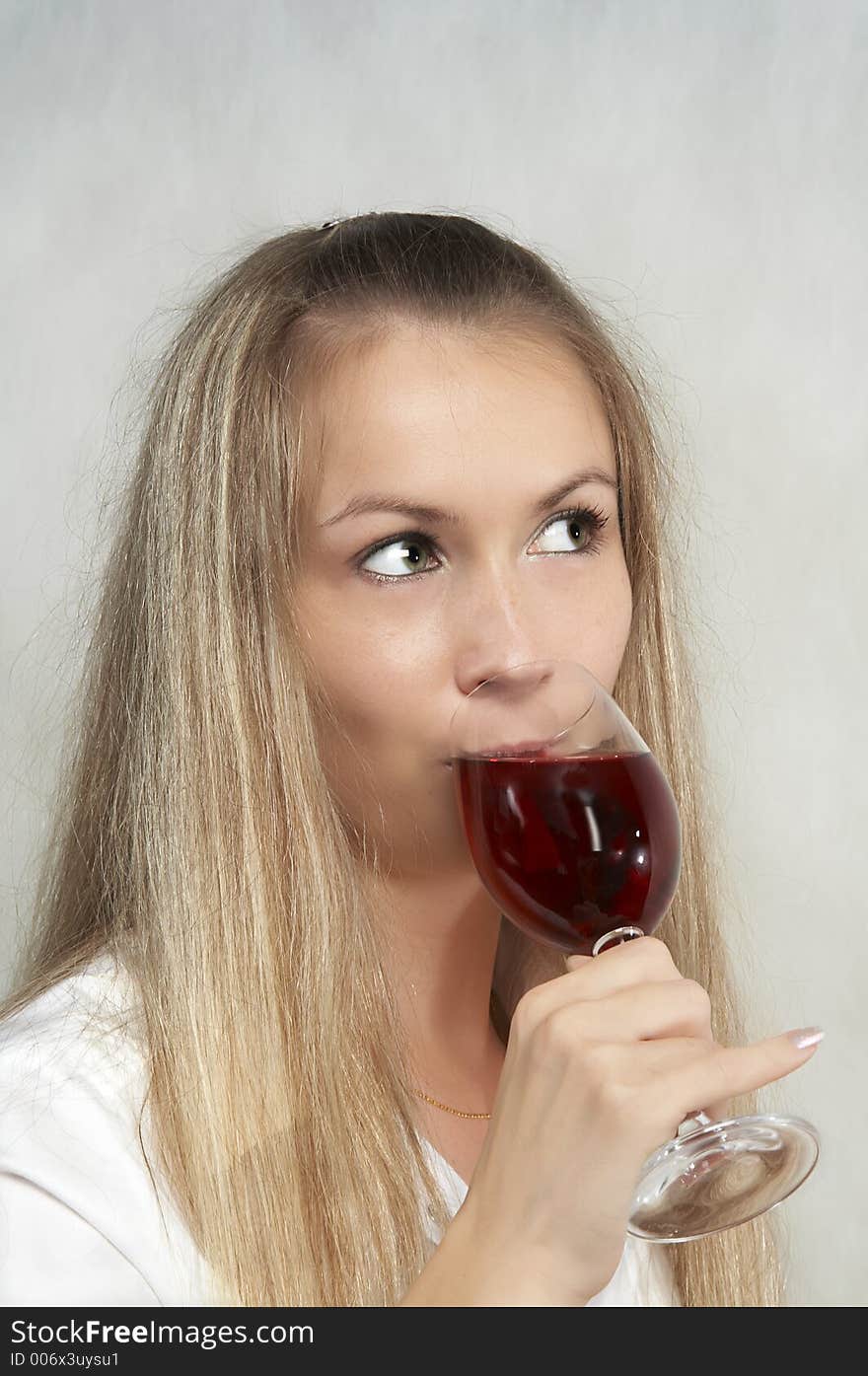 The girl with a glass of wine