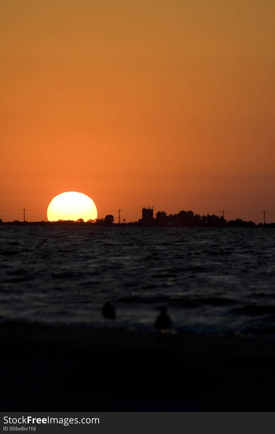 Sea Sunrise landscape, with buildings in the foreground. Sea Sunrise landscape, with buildings in the foreground