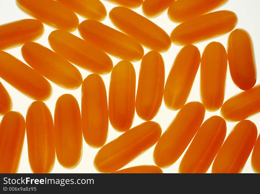 Group of yellow or orange pills. Group of yellow or orange pills