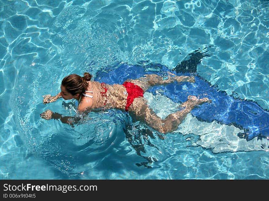 Girl swimming in the pool