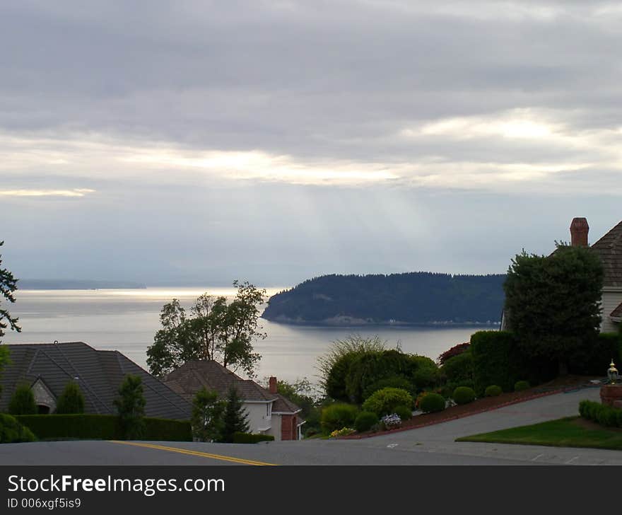 An early evening view of puget sound under dark sunlight. An early evening view of puget sound under dark sunlight