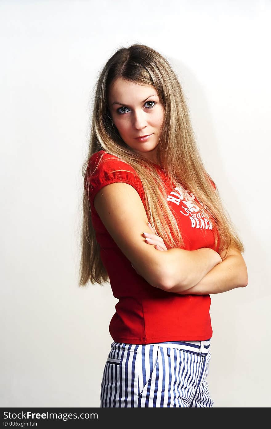 The attractive girl in a red vest