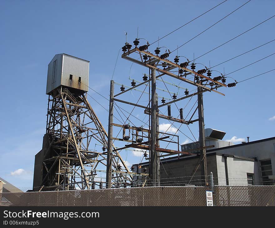 Tower at a salt mine site with power lines in foreground. Tower at a salt mine site with power lines in foreground