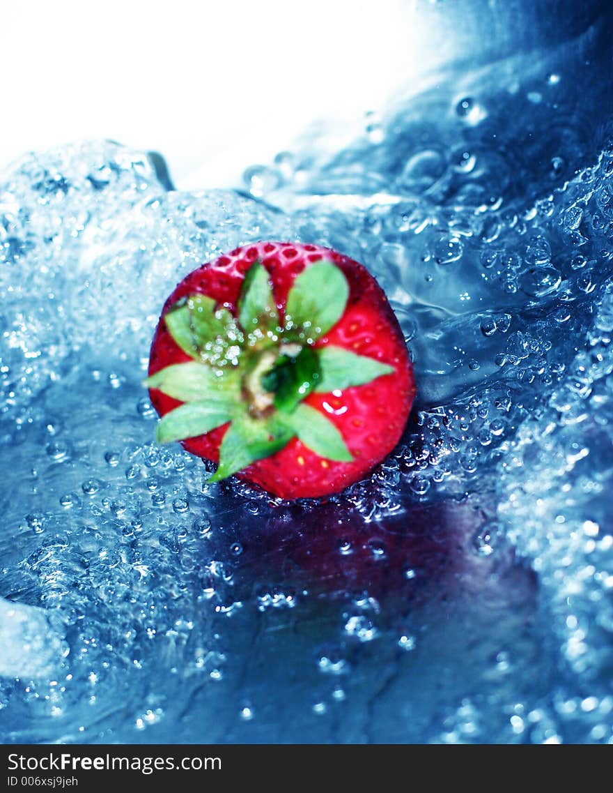 Rushing, blue water with fresh strawberry. Rushing, blue water with fresh strawberry