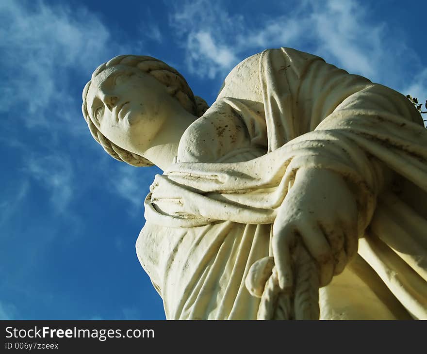 Antique statue and blue sky