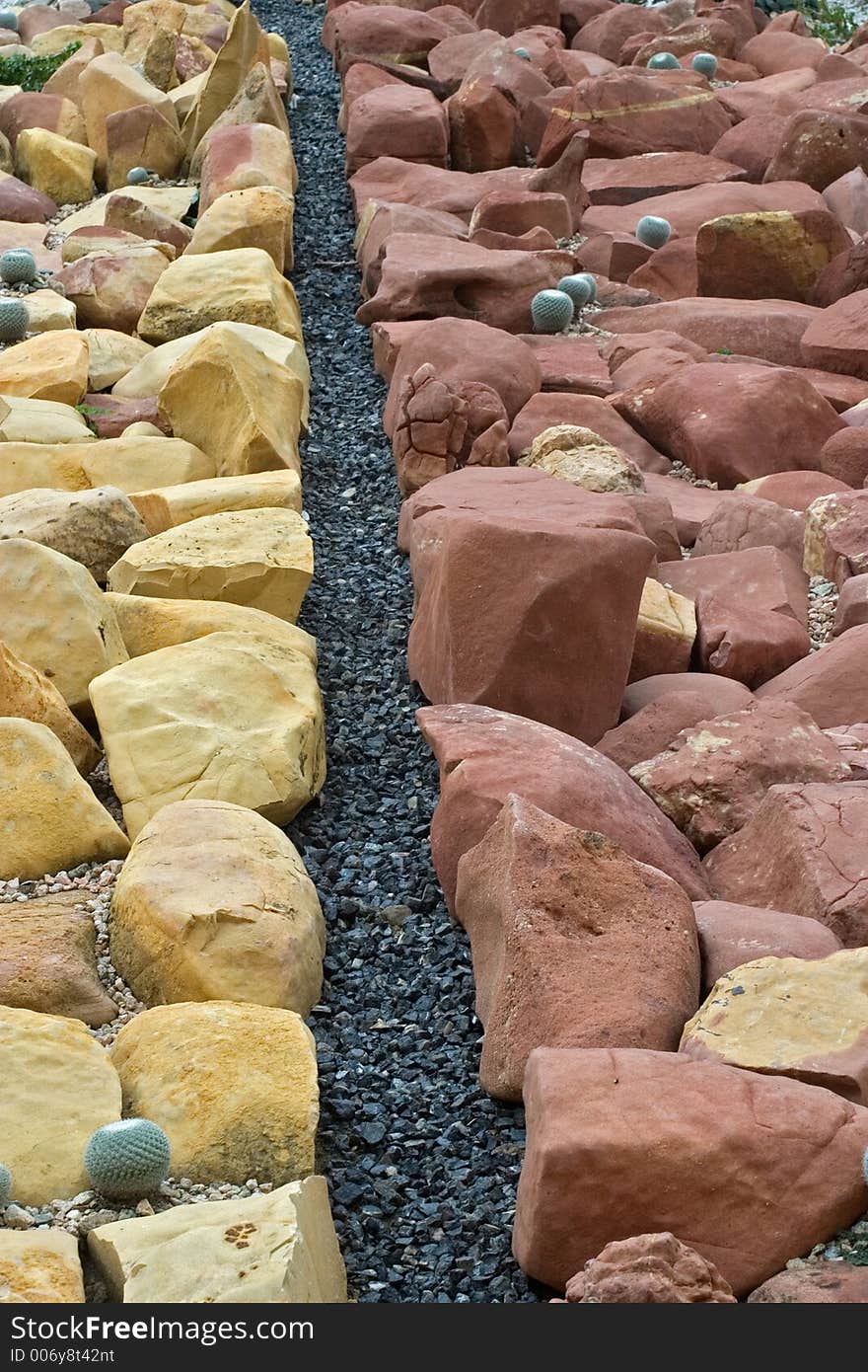 Red and Yellow Rocks in a Garden. Red and Yellow Rocks in a Garden