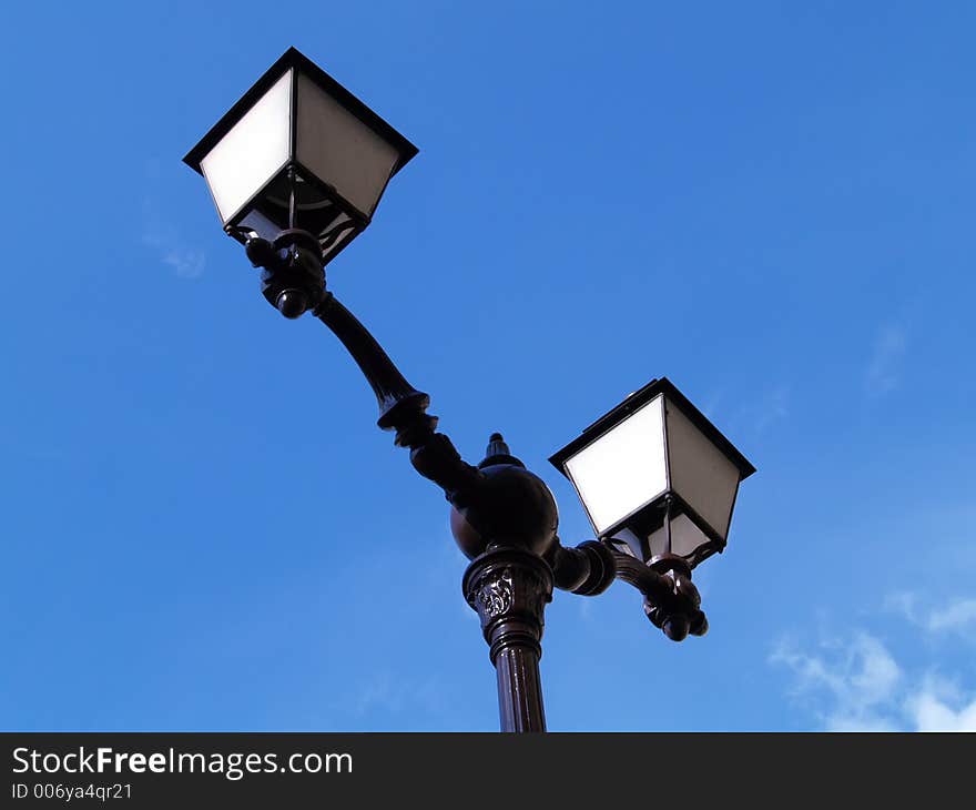 Lamp over blue sky