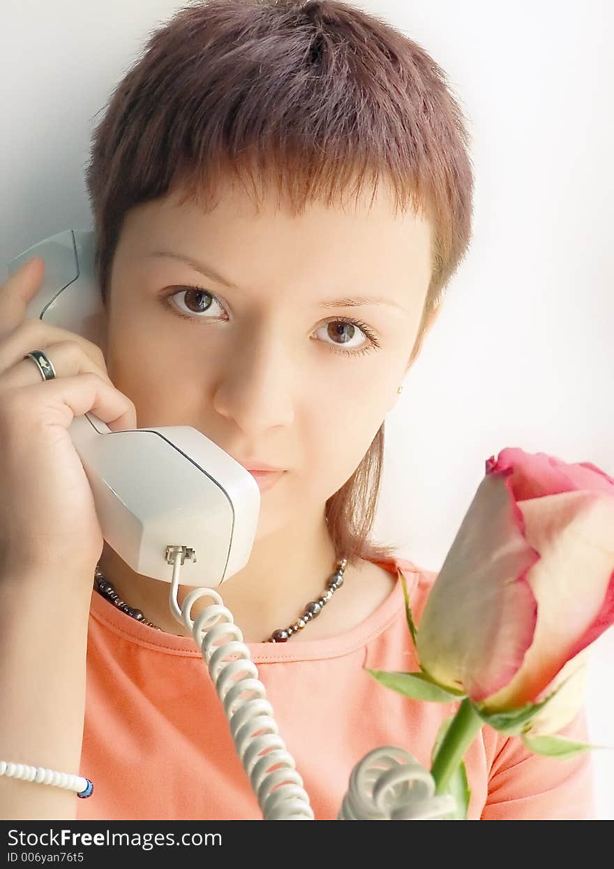 Girl with rose speak phone. Girl with rose speak phone