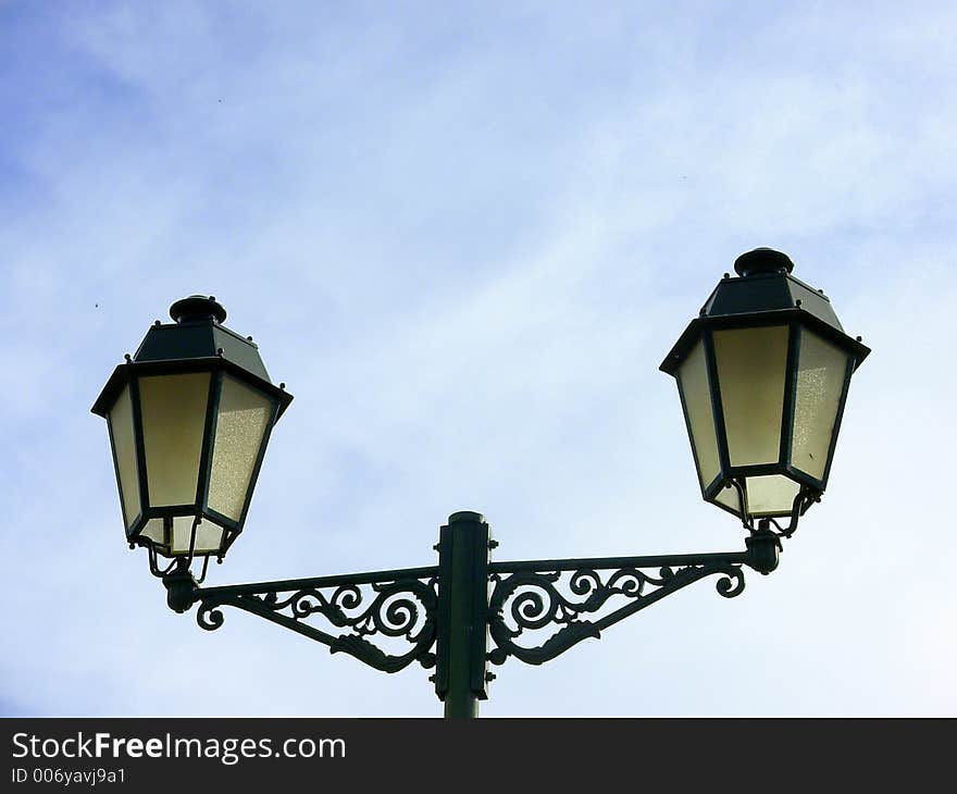 Oil lamp with lanterns in a square of the city of Elvas, south of Portugal