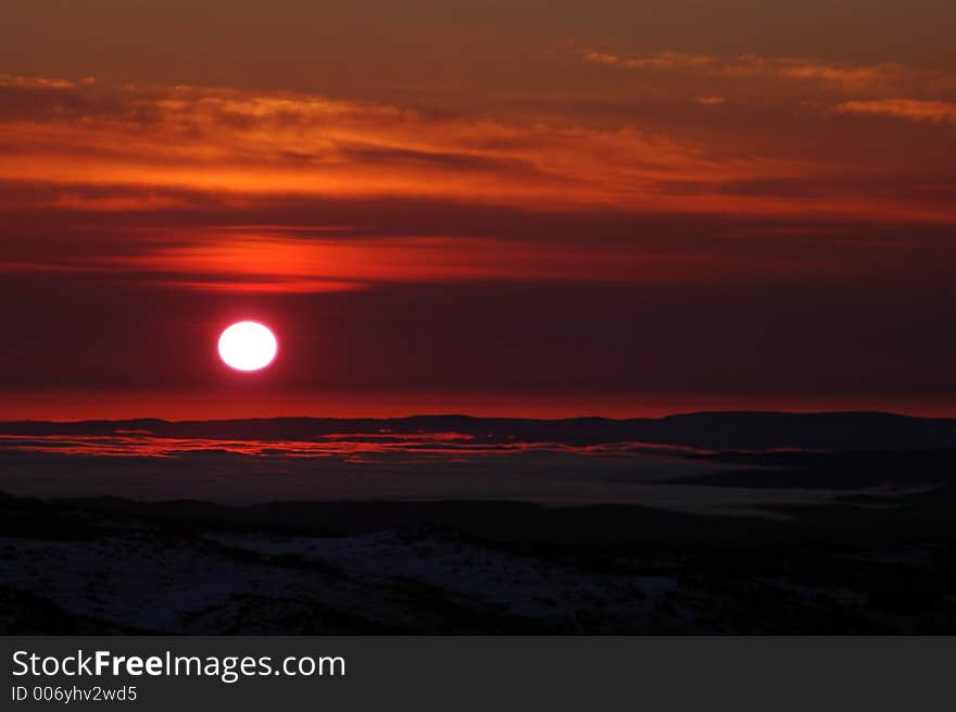 Early morning bloody sunrise over clouds. Early morning bloody sunrise over clouds