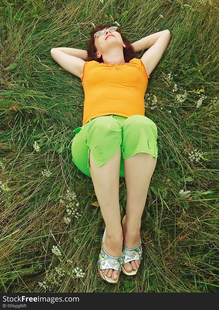 Girl reposes on grass, meadow. Girl reposes on grass, meadow