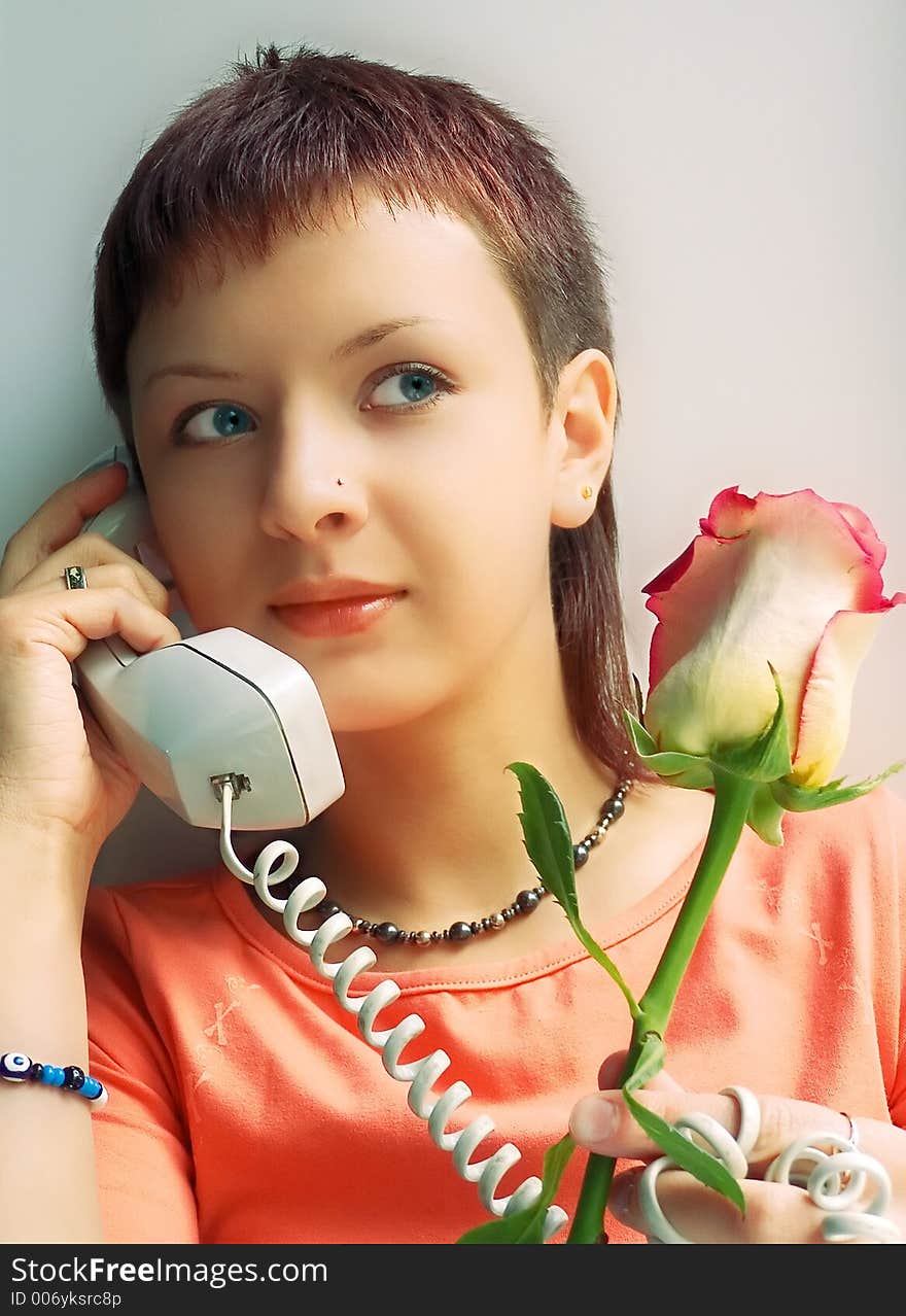 Girl with rose speak phone. Girl with rose speak phone