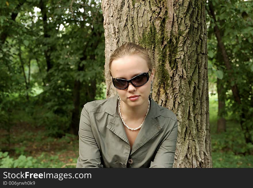 Beautiful Girl Sitting On A Park