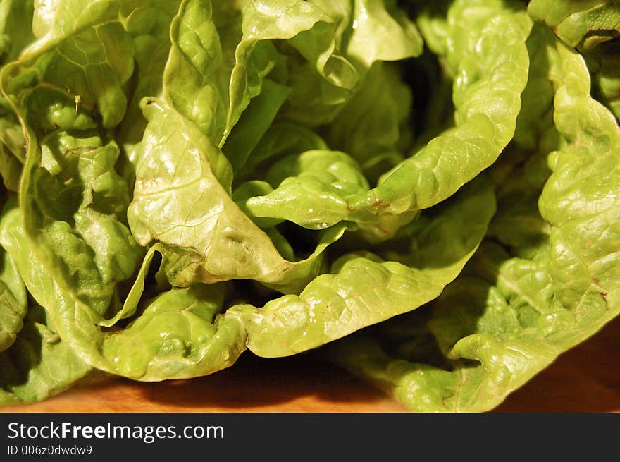 green Lettuce on a wooden chopping board