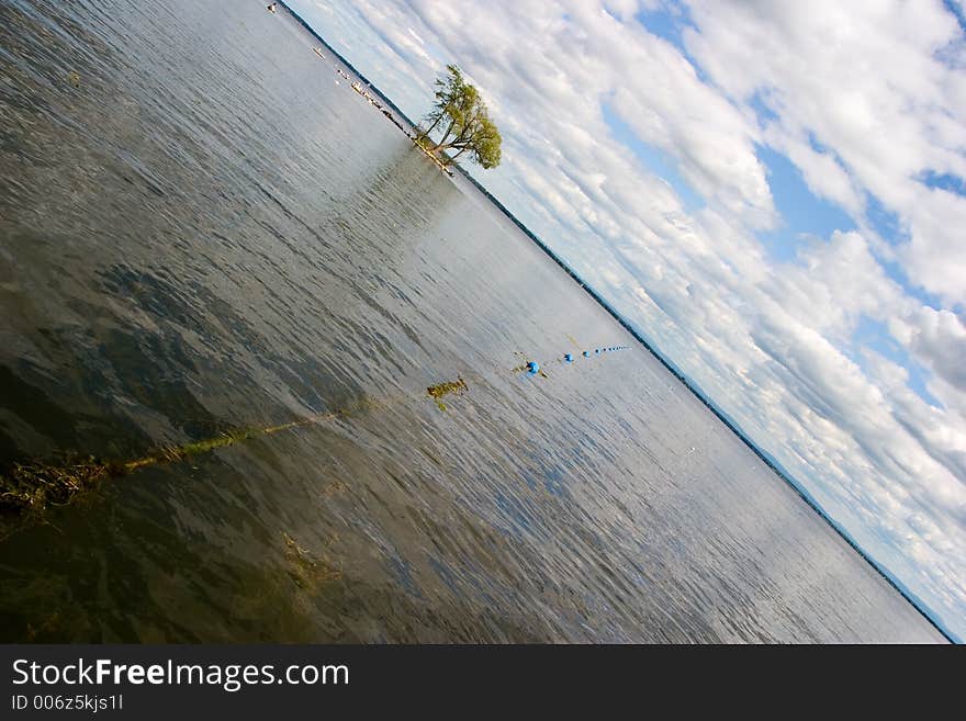 Buoys on a line establish the swimming limits at the beach. Buoys on a line establish the swimming limits at the beach