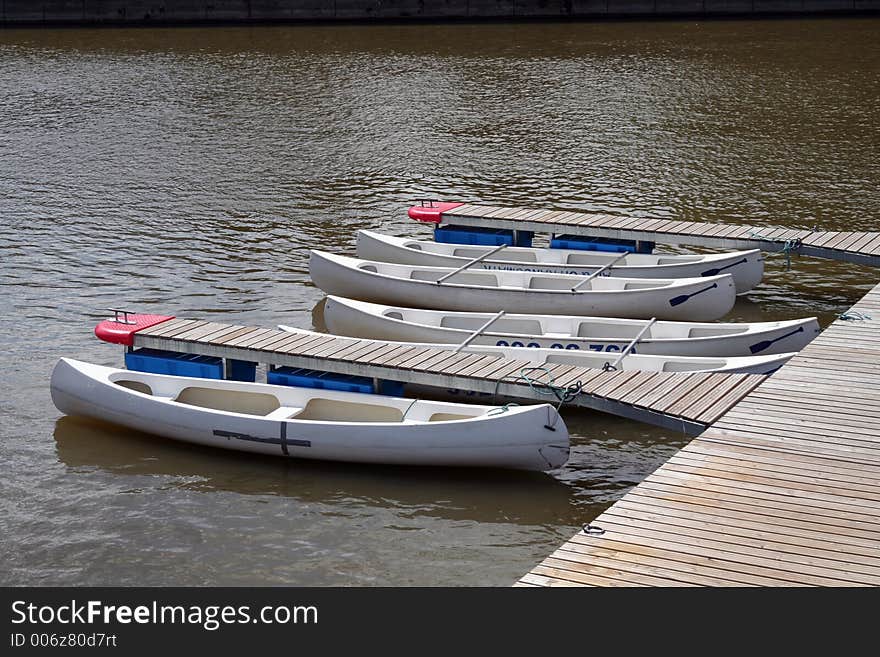 Canoes for rent docked by the river