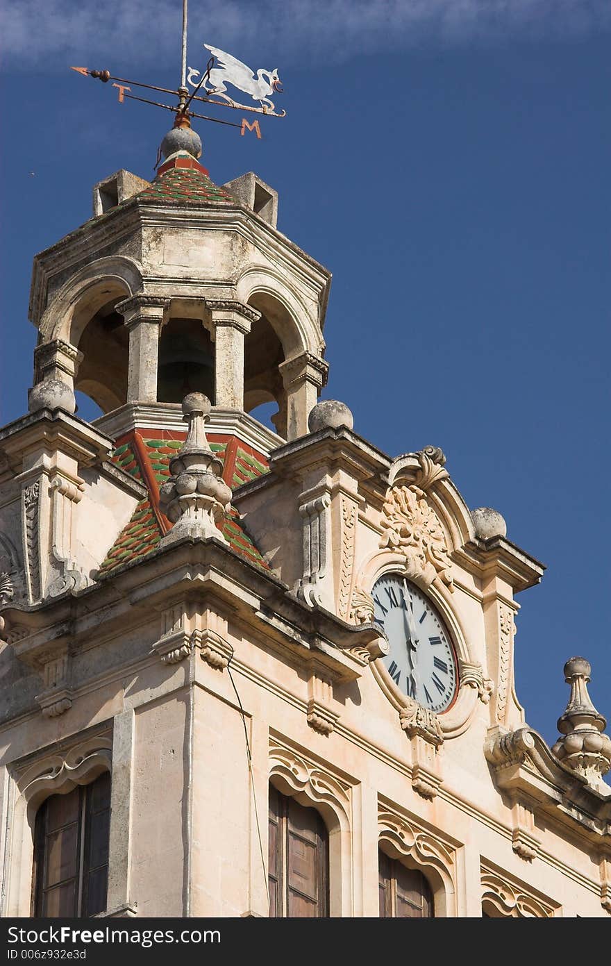 Town hall tower and clock against a blue sky. Town hall tower and clock against a blue sky