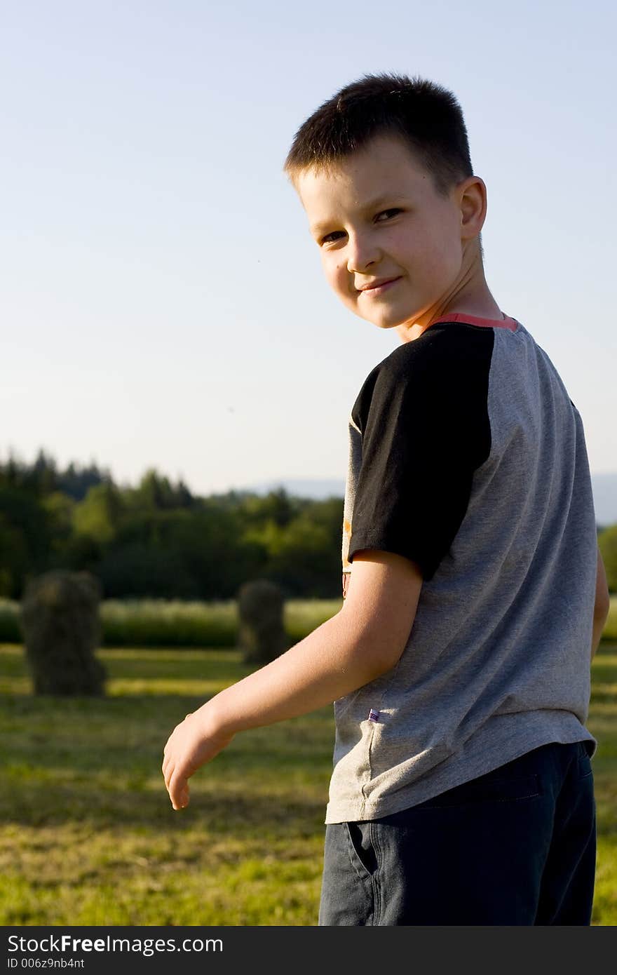 Boy smiling on a meadow