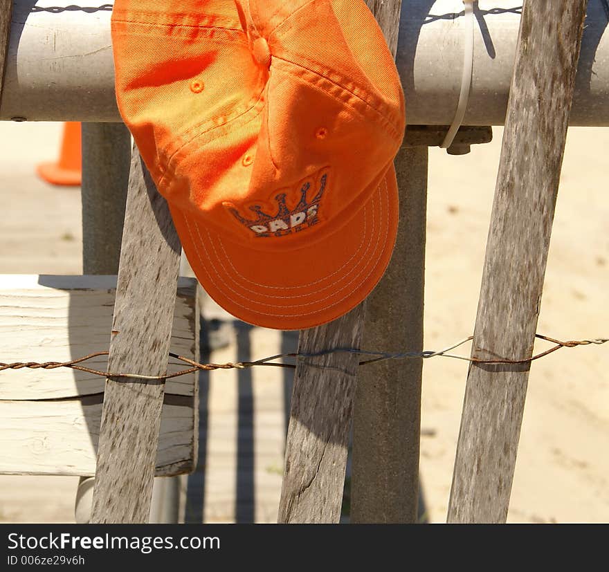 Dad's hat on a fence