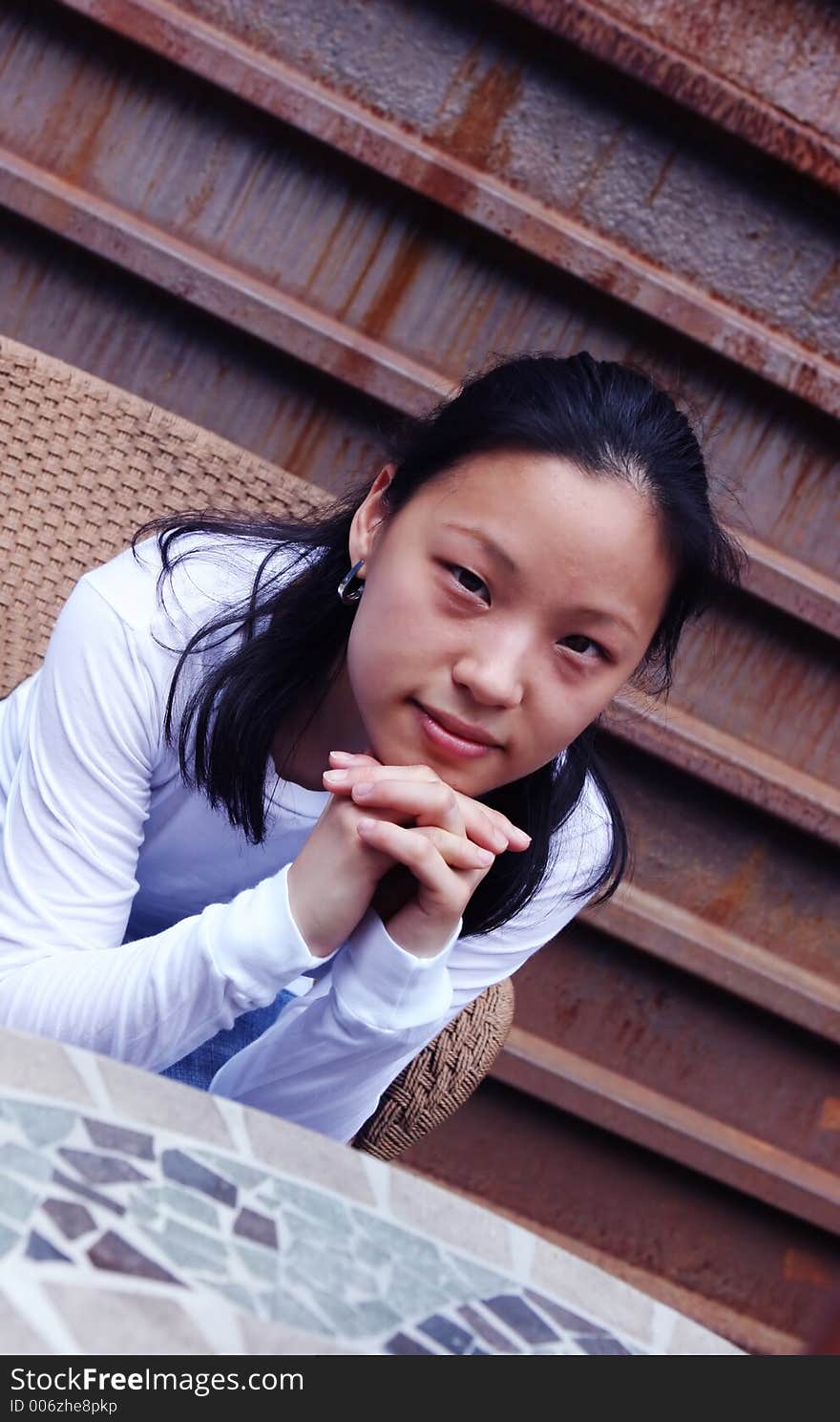 Portrait of a Korean woman sitting at a table. Portrait of a Korean woman sitting at a table