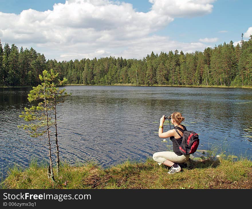 Teenage Girl Watches To Other Side Of The Lake