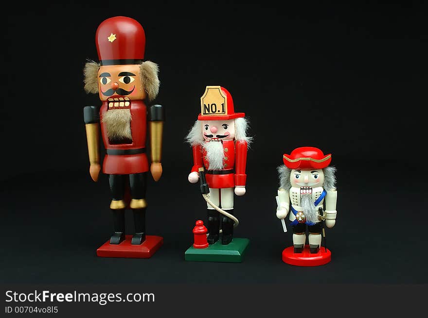 Three German nutcrackers displayed on a black background. Three German nutcrackers displayed on a black background.