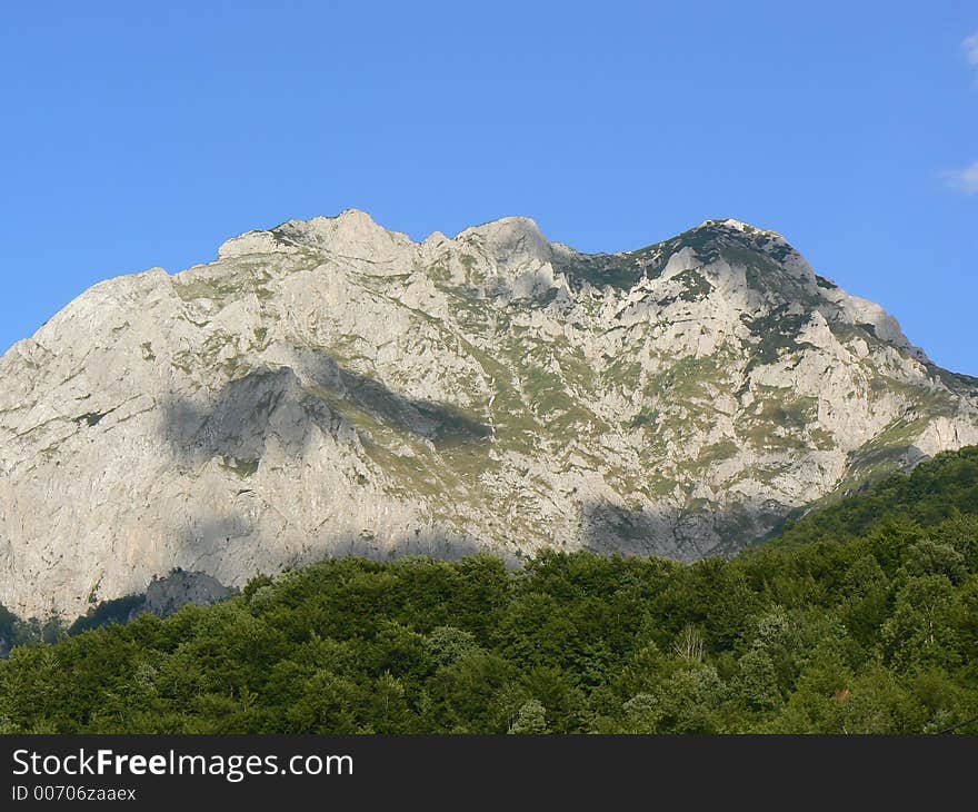 Mountain peak above dense forest in Bosnia. Mountain peak above dense forest in Bosnia