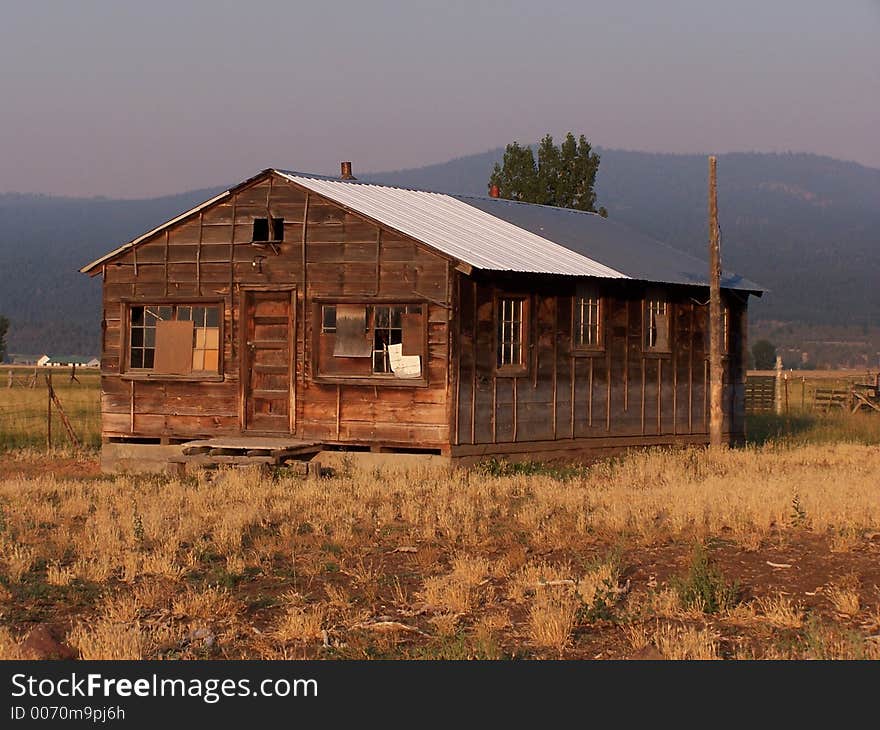 Very old farm building in morning light. Very old farm building in morning light.