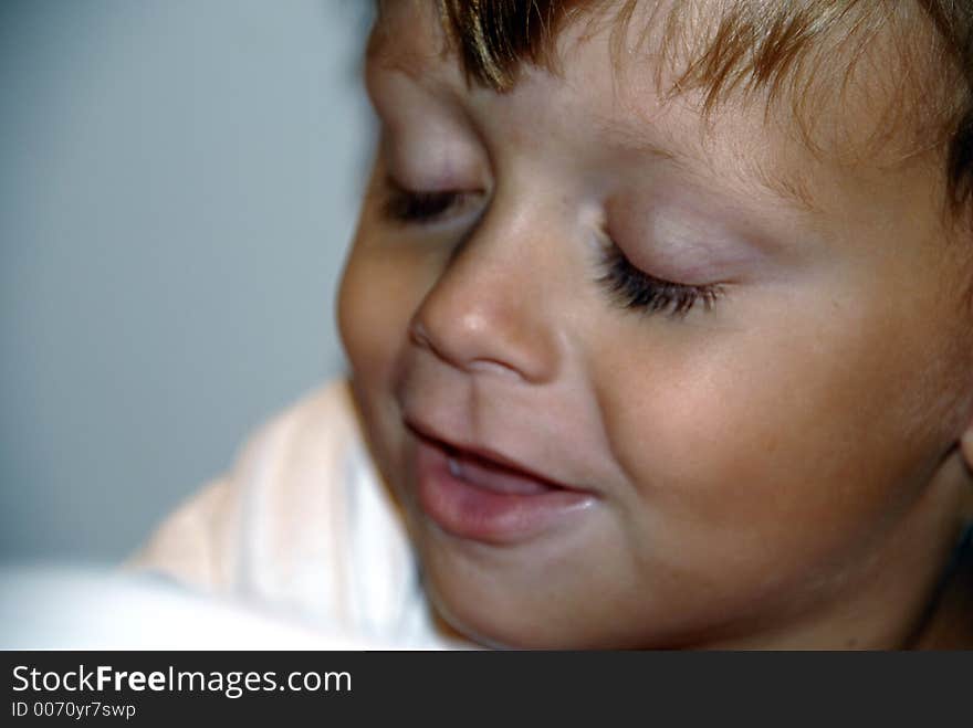 Boy with long eyelashes and his eyes closed to show them off. Boy with long eyelashes and his eyes closed to show them off