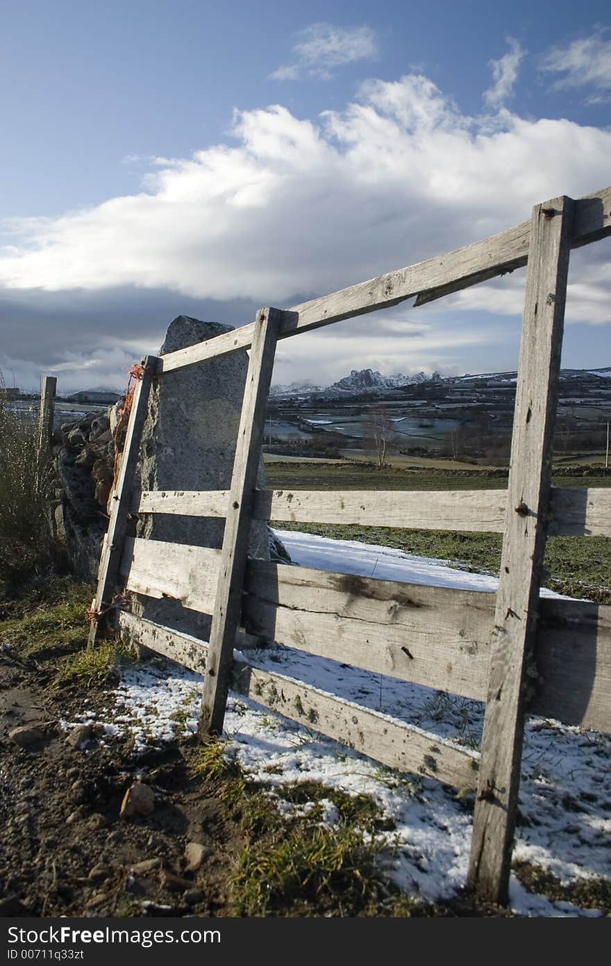 Mountain framed on a fence