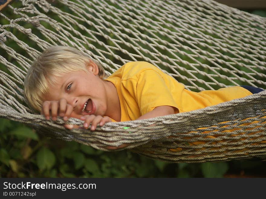 Little boy playing on hammock. Little boy playing on hammock