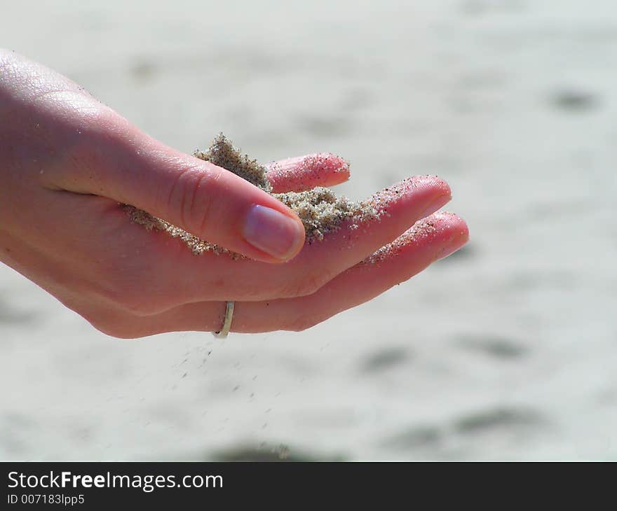 Sands flows through fingers. Sands flows through fingers