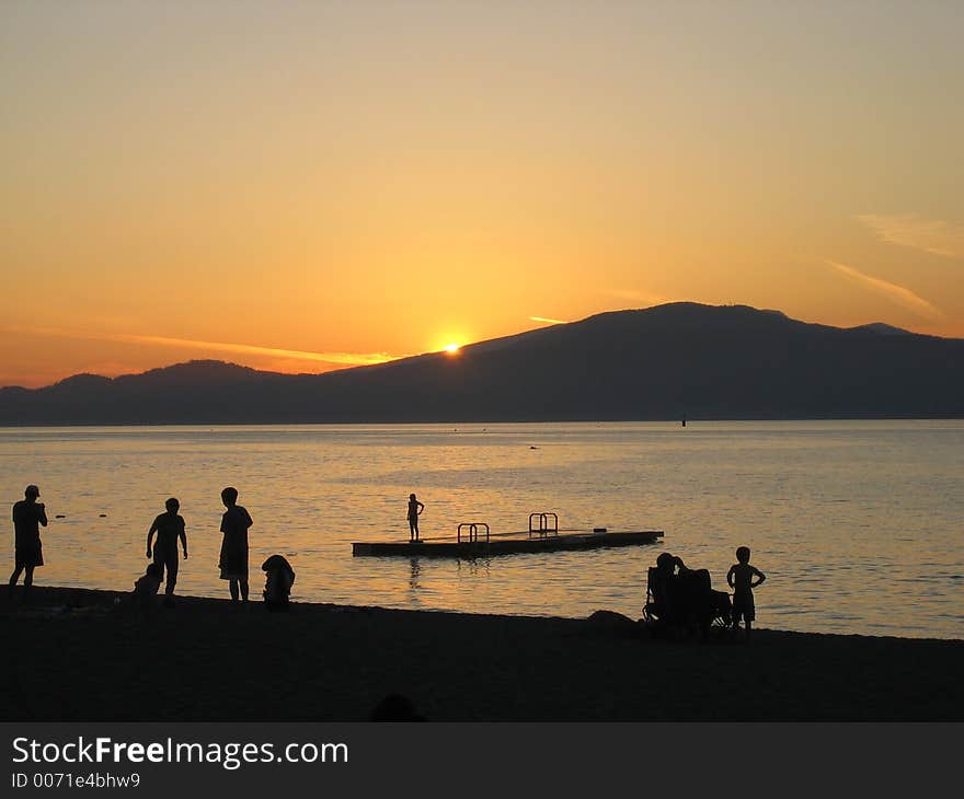 Silhouettes on the beach in the sunset. Silhouettes on the beach in the sunset