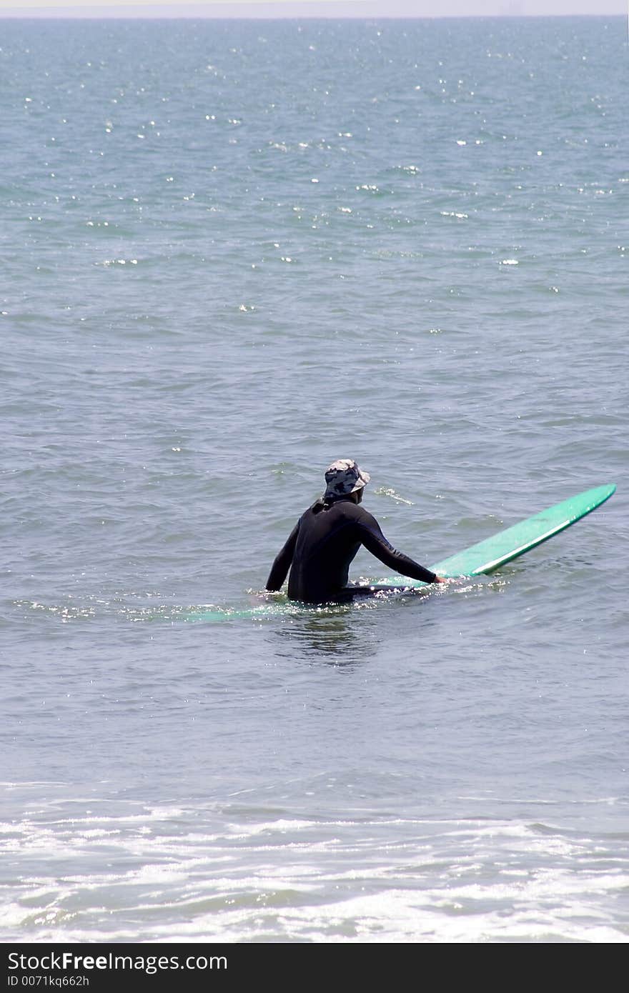 Surfer On Green Board