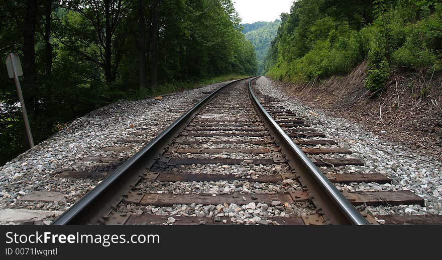 Railroad track curving into distance, low angle. Railroad track curving into distance, low angle