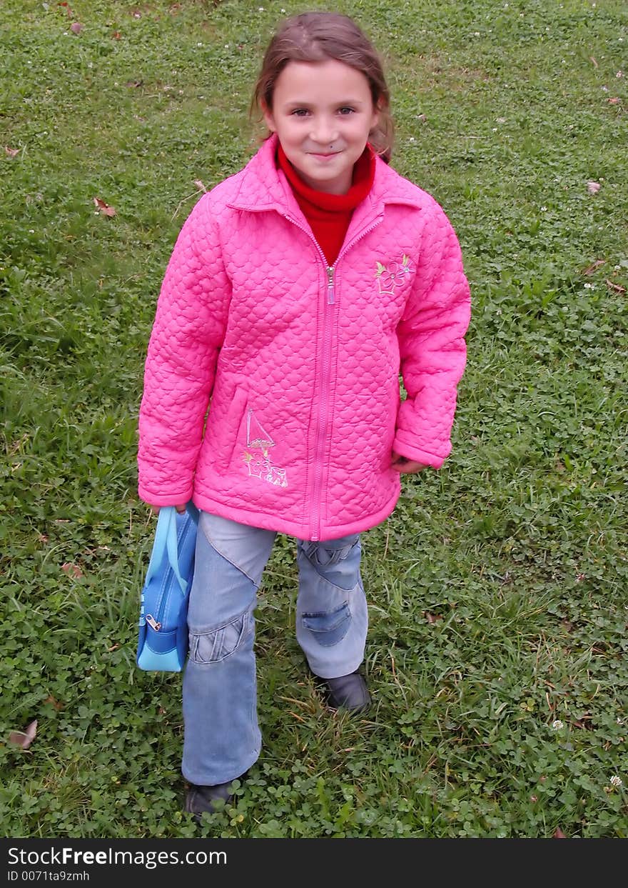 Pretty girl smiling in the grass