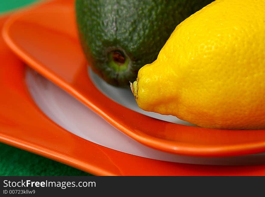 Macro of lemon and avocado on plate