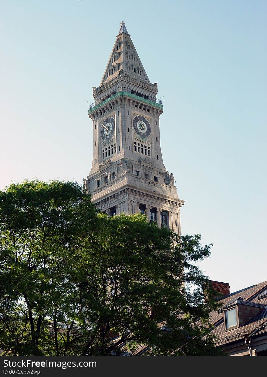 Clock tower in downtown boston against blue, sky, early morning. Clock tower in downtown boston against blue, sky, early morning