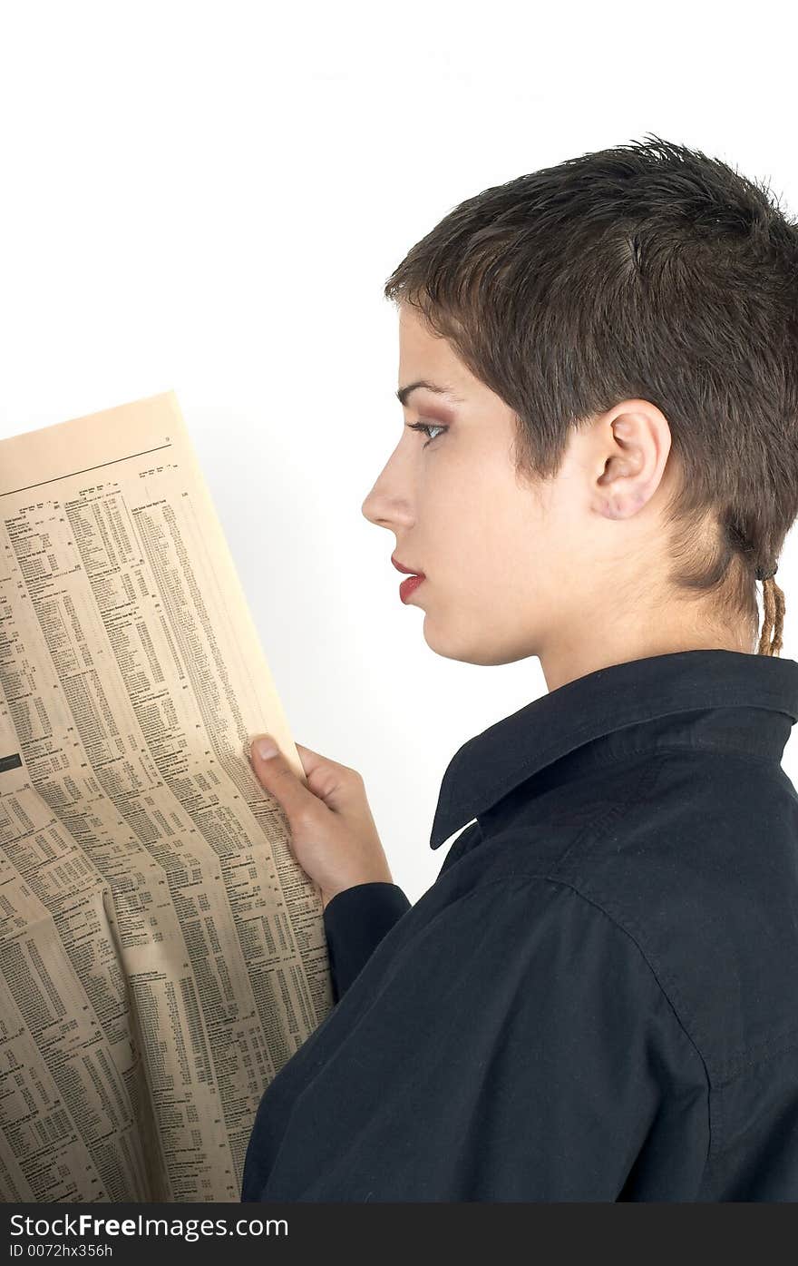 Young businesswoman reading a newspaper. Young businesswoman reading a newspaper