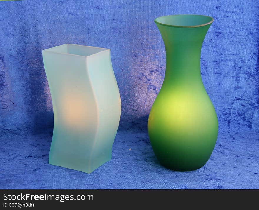 Green vases, blue background. Green vases, blue background