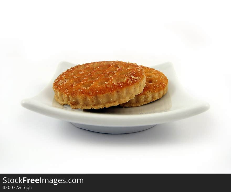 Biscuits on white plate close-up detail