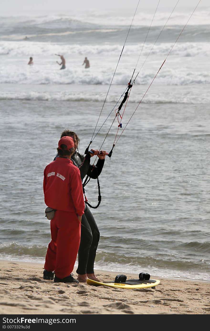 Lifeguard and kitesurfer talking portrait