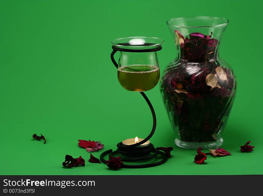 Liquid potpourri and a vase of dried flower. Liquid potpourri and a vase of dried flower